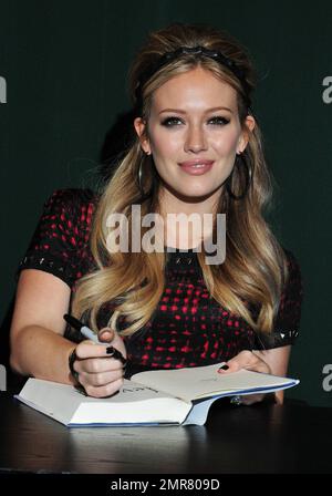 Hilary Duff signs copies of her new book 'Devoted' at Barnes & Noble in New York, NY. 10th October 2011.    . Stock Photo