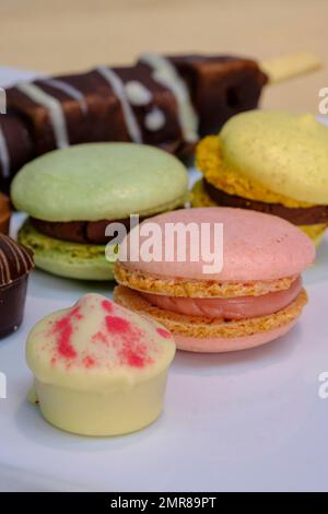 Macrons, sweets on buffet, reception Stock Photo