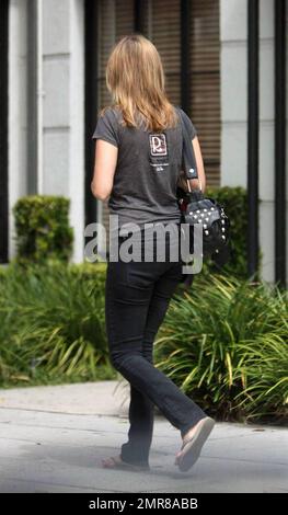 EXCLUSIVE!! Australian actress and pop star Holly Valance was seen out and about in Los Angeles this morning. The 26-year-old singer and 'Neighbours' pin-up was seen visiting a medical center in Beverly Hills and left the center with what appeared to be a cup of coffee and prescription medicine. Valance, who wasn't sporting any rings on her fingers, appeared to be happy and fit. It's reported that Valance just released a new CD called 'Superstar' and is set to star in the upcoming film 'Luster.'  Los Angeles, CA.  7/29/09. Stock Photo