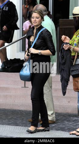 EXCLUSIVE!! Model turned actress, Holly Valance, leaves South Beach after checking out of her luxury hotel where she had been staying with her boyfriend Nick Candy and friends. Valance, best known for her bikini figure, was in good spirits and enjoyed a leisurely lunch before leaving town and saying her farewells. Miami Beach, FL. 12/29/10 Stock Photo