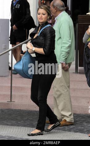 EXCLUSIVE!! Model turned actress, Holly Valance, leaves South Beach after checking out of her luxury hotel where she had been staying with her boyfriend Nick Candy and friends. Valance, best known for her bikini figure, was in good spirits and enjoyed a leisurely lunch before leaving town and saying her farewells. Miami Beach, FL. 12/29/10 Stock Photo