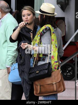 EXCLUSIVE!! Model turned actress, Holly Valance, leaves South Beach after checking out of her luxury hotel where she had been staying with her boyfriend Nick Candy and friends. Valance, best known for her bikini figure, was in good spirits and enjoyed a leisurely lunch before leaving town and saying her farewells. Miami Beach, FL. 12/29/10 Stock Photo