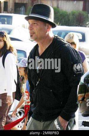 Comedian, TV personality and self-professed germaphobe Howie Mandel gets out of his mini red Smart car and signs an autograph before dining at Nobu Restaurant. Los Angeles, CA. 07/03/10. Stock Photo