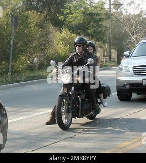 Exclusive!! Hugh Laurie takes his daughter Rebecca for a ride on his Triumph Bonneville motorcycle in Beverly HIlls, Calif. 8/22/07. Stock Photo