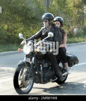 Exclusive!! Hugh Laurie takes his daughter Rebecca for a ride on his Triumph Bonneville motorcycle in Beverly HIlls, Calif. 8/22/07. Stock Photo