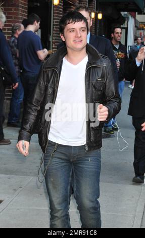 On the eve of the release of the highly anticipated film 'The Hunger Games' actor Josh Hutcherson wears a black leather jacket, white t-shirt and blue jeans as he arrives for an appearance on 'The Late Show with David Letterman' at the Ed Sullivan Theatre in New York, NY. 20th March 2012. Stock Photo