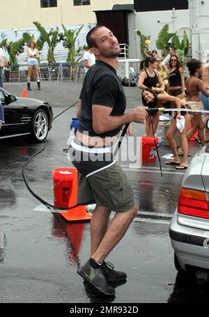 Hurricane relief bikini car wash hi-res stock photography and