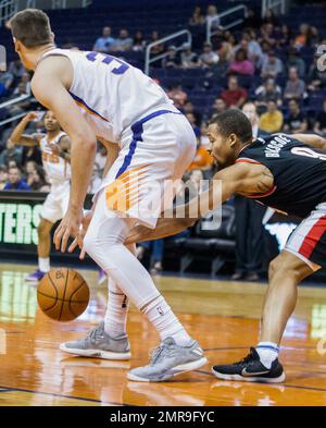 Portland Trail Blazers guard Isaiah Rider gets to the basket ahead of  Phoenix Suns' Tom Gugliotta for an easy layup during their first-round NBA  playoff game in Portland, Ore., Monday, May 10