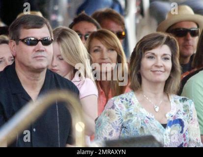 Actress and producer Jane Seymour enjoys a day out with her 15-year-old twin sons Johnny and Kris Keach during the Labor Day weekend Malibu Chili Cook Off gathering.  Proud mom Jane watched on as her boys entertained the crowd by playing a gig with their band.  Johnny and Kris seemed to get kick out of being on stage, playing drums and guitar while Jane, simply dressed in a pink blouse and white pants, took photos and couldn't help but smile. Los Angeles, CA. 09/04/10. Stock Photo