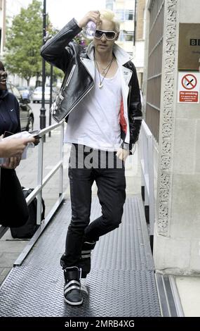 Actor and 30 Seconds to Mars lead singer Jared Leto arrives to BBC Radio 1 for an interview and disappoints fans by not signing any autographs.  The bleach blonde, leather jacket and high-top sneaker clad rocker later left the studio.  30 Seconds to Mars is currently in the middle of a world tour. London, UK. 07/08/10.   . Stock Photo