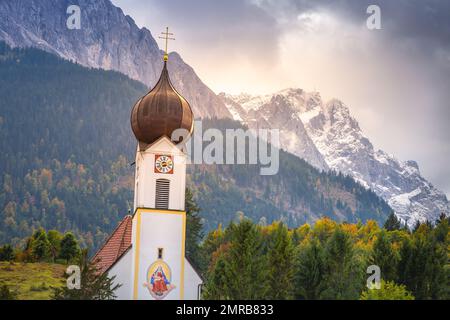 Grainau Church at golden autumn and Zugspitze, Garmisch Partenkirchen, Germany Stock Photo