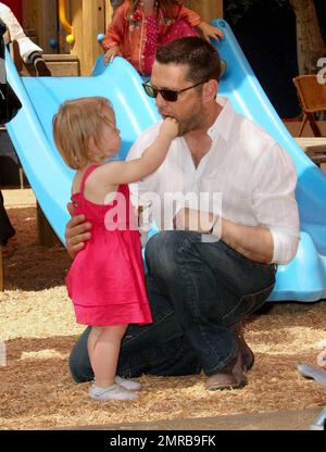 Actor/Director Jason Priestley was seen attending the 'Pregnancy Awareness Month' event in Santa Monica with his wife Naomi and 22 month old daughter Ava.  The event was held at the Little Dolphins By The Sea Preschool.  Jason and Ava spent most of their time playing at the playground.  Los Angeles, CA.  5/2/09. Stock Photo