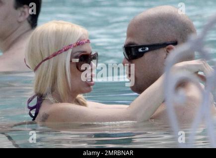 Jenna Jameson in a hot glittery purple bikini and hubby Tito Ortiz