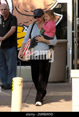 A dressed down Jennifer Garner takes daughter Violet to a local grocery store this afternoon to pick up some essentials.  Jennifer is expecting her second child before the end of November.  Los Angeles, CA.  11/16/08. Stock Photo