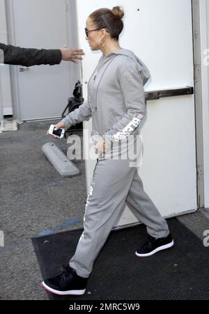 EXCLUSIVE!! Wearing black sneakers and a grey hoodie and sweat