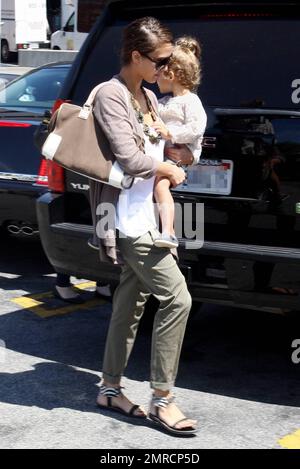 actress jessica alba carries 2 year old daughter honor marie back to her car while out with a friend for some shopping jessica took a moment to look adoringly at her little one before putting her in the yukon hybrid suv alba who has a string of films coming out in 2010 including the killer inside me machete and little fockers donned trendy pleated and cuffed green trousers a chunky necklace and zebra patterned sandals los angeles ca 080310 2mrcp5d