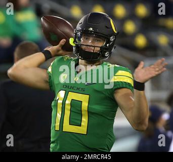 Oregon quarterback Justin Herbert warms up before the the team's NCAA  college football game against Arizona on Saturday, Nov. 18, 2017, in  Eugene, Ore. Herbert has been out with an injury. (AP