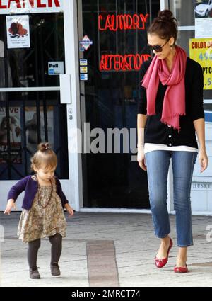 Doting mom Jessica Alba looks on as her daughter Honor practices walking while leaving a restaurant in West Hollywood. Jessica keeps close to come to Honor's aid in case of an accidental fall and later holds her hand while they head to thier vehicle. Los Angeles, CA. 11/8/09. Stock Photo