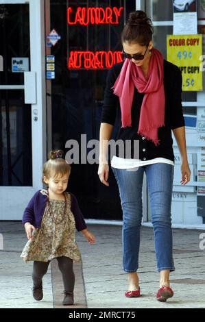 Doting mom Jessica Alba looks on as her daughter Honor practices walking while leaving a restaurant in West Hollywood. Jessica keeps close to come to Honor's aid in case of an accidental fall and later holds her hand while they head to thier vehicle. Los Angeles, CA. 11/8/09. Stock Photo