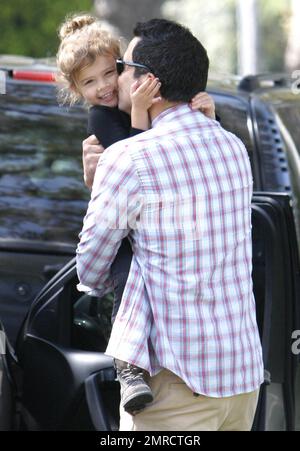 Jessica Alba looks fabulous just a month after giving birth to her second daughter, Haven Garner with husband Cash Warren. The couple was seen spending time with their first born Honor Marie, minus baby sister, in Beverly Hills. Jessica was seen holding Honor's hand who was eating a cupcake and had her face painted.  Super dad, Cash was seen picking the cutie up in a tight hug and giving her a kiss. Beverly Hills, CA. 17th September 2011.    . Stock Photo