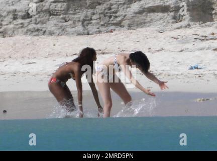 EXCLUSIVE!! British singer Jessie J reveals her incredible bikini body and tattoos during a Caribbean break. Jessie wore a colorful bikini as she played in the water-park and took a walk on the beach with a group of female friends. The 'Do It Like A Dude' singer was also spotted jumping into the air with her pals and posing for some holiday snaps with the group. Caribbean. 5/25/11. Stock Photo