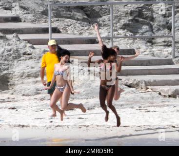 EXCLUSIVE!! British singer Jessie J reveals her incredible bikini body and tattoos during a Caribbean break. Jessie wore a colorful bikini as she played in the water-park and took a walk on the beach with a group of female friends. The 'Do It Like A Dude' singer was also spotted jumping into the air with her pals and posing for some holiday snaps with the group. Caribbean. 5/25/11. Stock Photo