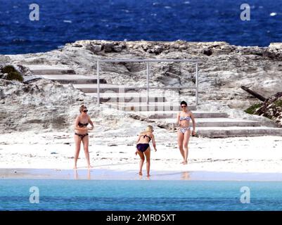 EXCLUSIVE!! British singer Jessie J reveals her incredible bikini body and tattoos during a Caribbean break. Jessie wore a colorful bikini as she played in the water-park and took a walk on the beach with a group of female friends. The 'Do It Like A Dude' singer was also spotted jumping into the air with her pals and posing for some holiday snaps with the group. Caribbean. 5/25/11. Stock Photo