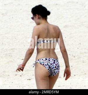 EXCLUSIVE!! British singer Jessie J reveals her incredible bikini body and tattoos during a Caribbean break. Jessie wore a colorful bikini as she played in the water-park and took a walk on the beach with a group of female friends. The 'Do It Like A Dude' singer was also spotted jumping into the air with her pals and posing for some holiday snaps with the group. Caribbean. 5/25/11. Stock Photo