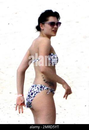 EXCLUSIVE!! British singer Jessie J reveals her incredible bikini body and tattoos during a Caribbean break. Jessie wore a colorful bikini as she played in the water-park and took a walk on the beach with a group of female friends. The 'Do It Like A Dude' singer was also spotted jumping into the air with her pals and posing for some holiday snaps with the group. Caribbean. 5/25/11. Stock Photo