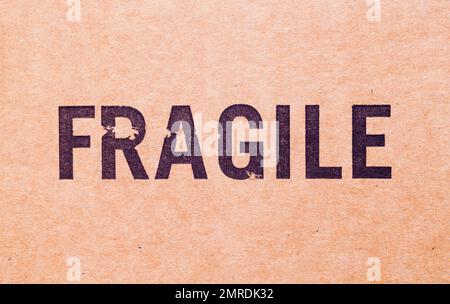 Brown Cardboard Box With Fragile Stamp Background. Stock Photo