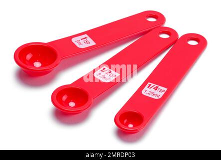 Three Measuring Spoons Cut Out on White. Stock Photo