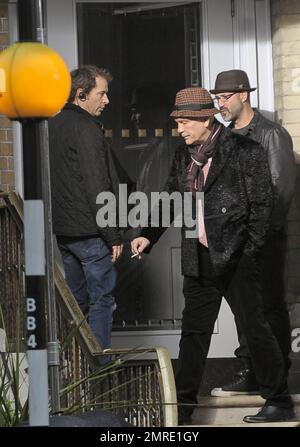 Actor John Malkovich smokes a cigarette while on the set of 'Red 2' in London, UK. 12th November 2012. Stock Photo