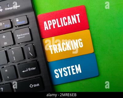 Black wireless keyboard with the word APPLICANT TRACKING SYSTEM Stock Photo