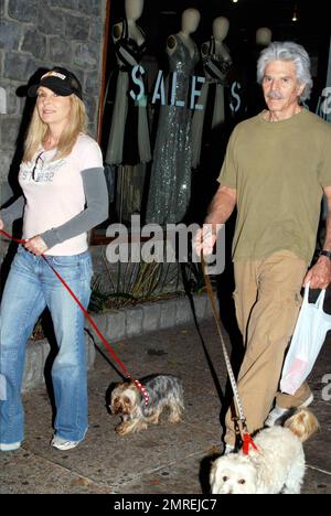 Mexican actor of Spanish descent Jorge Rivero walks his dogs with a female friend on Robertson Blvd in Los Angeles, CA. 9/11/09. Stock Photo