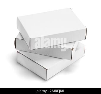 Three Small White Cardboard Boxes Stacked Cut Out. Stock Photo