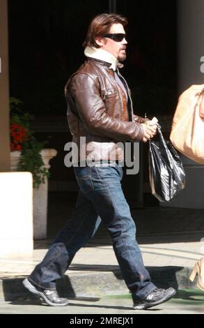 Actor Josh Brolin leaves the luxury Four Seasons hotel wearing a neck brace, carrying a plastic bag and some cash to tip the valet.  Brolin's latest film 'Jonah Hex', a action western based on a comic book and co-starring John Malkovich and Megan Fox, is set to his theaters next weekend. Los Angeles, CA. 06/12/10. . Stock Photo