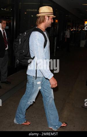 'Lost' actor Josh Holloway at LAX with wife Yessica Kumala and their one-year-old daughter Java after a flight in from Hawaii.  Josh seemed very happy as he smiled for fans while Yessica carried little Java. Los Angeles, CA. 04/26/10.   B Stock Photo