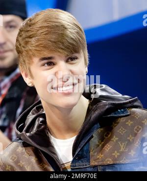Justin Bieber wears a denim Louis Vuitton jacket as he makes a special  appearance with television personality Allison Hagendorf at the Consime  Electronics Show at the Las Vegas Convention Center. Bieber helped