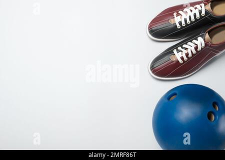 Bowling shoes and bowling ball on white background. Indoor family