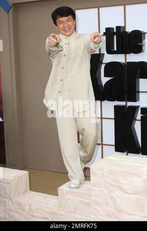 Jackie Chan walks the red carpet and poses on a prop at the premiere of 'The Karate Kid' held at Grauman's Chinese Theatre.  Chan, who is known for his long career in kung fu films, plays the role of mentor Mr. Han in the remake of the 1984 film of the same title.  The original star of the popular film, Ralph Macchio, was also at the premiere . Los Angeles, CA. 06/07/10. Stock Photo