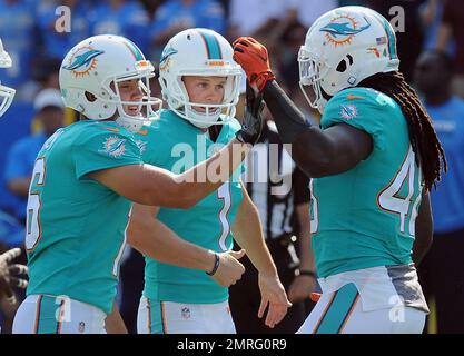 Miami Dolphins kicker (1) Cody Parker and punter (16) Matt Haack react  after a successful Parker field goal in the fourth quarter of an NFL game  against the Los Angeles Chargers played