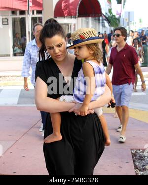 Kourtney and Khloe Kardashian take to the town in search of a possible new location for their Dash clothing store. Accompanied by Scott Disick and Jonathan Cheban and Kourtney's son Mason, who was spotted seemingly picking his nose, the group and their film crew visited several buildings along the famed Collins Avenue. Miami Beach, FL. 19th September 2012. Stock Photo