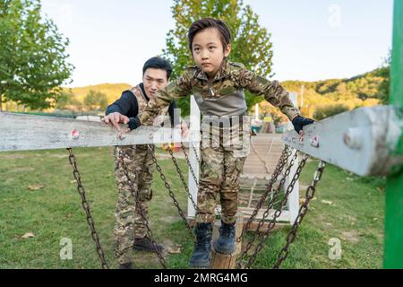 Father took son play cs Stock Photo