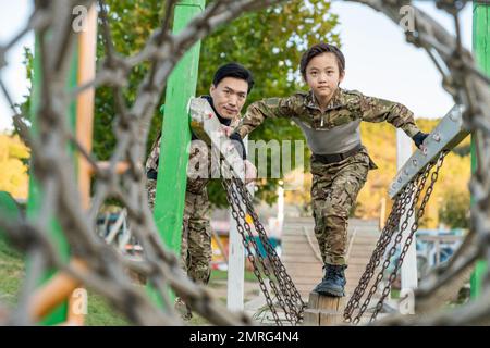 Father took son play cs Stock Photo