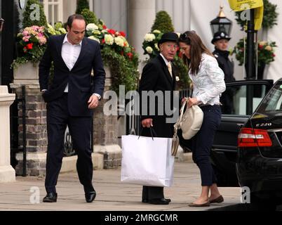 Kate Middleton arrives at The Goring Hotel where she will spend the night before her wedding to Prince William tomorrow. All the goings on are watched over by Jeremy Goring, owner of the hotel and friends and family arrive throughout the day and massive amounts of food and pastries are carried by chefs to the public and press gathered outside the hotel. London, UK. 4/28/11. Stock Photo