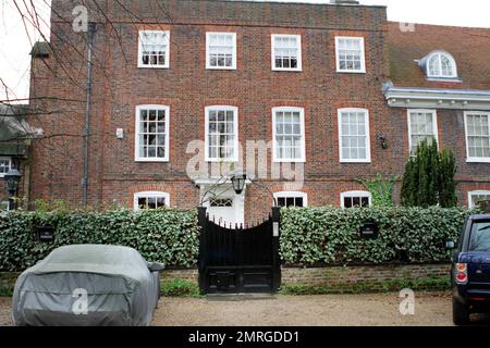 Exterior views of top model Kate Moss' new red brick Georgian-era mansion located in the exclusive and high-class Highgate suburb of London.  Moss, who reportedly purchased the seven-bedroom property for $11.9 million, will share the home with eight-year-old daughter Lila and boyfriend Jamie Hince.  The historic mansion, which is surrounded by charming wrought-iron gates and moss-covered trees, was purchased after Moss put her St. John's Wood home up for sale at the price of nearly $16 million after only living there for about two years.  And it appears that Moss and her musician boyfriend won Stock Photo