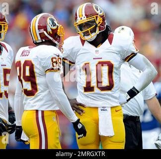 August 20, 2022, Indianapolis, Indiana, U.S: Indianapolis Colts quarterback  Nick Foles (9) huddles with his receivers during warmup for the preseason  game between the Detroit Lions and the Indianapolis Colts at Lucas