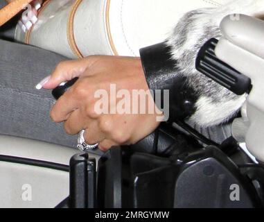 Katie Price leaves the Mayfair Hotel  in her white Range Rover Sport and matching white fur jacket separate from Alex Reid, London, UK, 04/20/10. Stock Photo