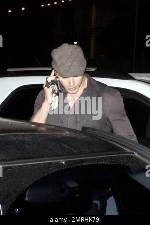 Hunky 'Twilight' and '90210' star Kellan Lutz chats on his cellphone as he leaves the nightclub Bardot in Los Angeles, CA. 11/24/08. Stock Photo