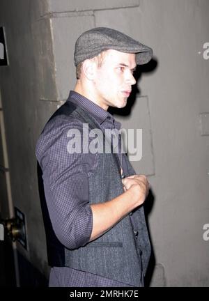 Hunky 'Twilight' and '90210' star Kellan Lutz chats on his cellphone as he leaves the nightclub Bardot in Los Angeles, CA. 11/24/08. Stock Photo